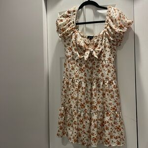 Cute, flower pattern dress with bow on the front